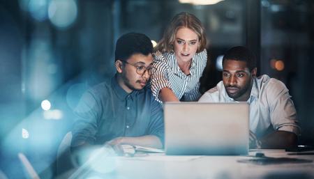 Business partners looking at a computer