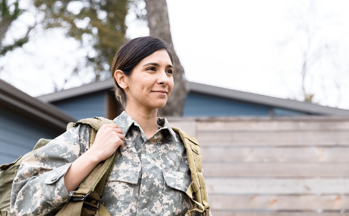 Female soldier with backpack. 