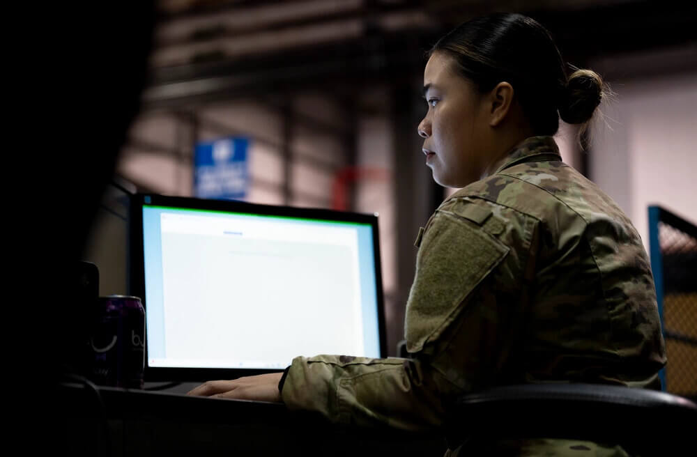 Air Force woman working at a computer