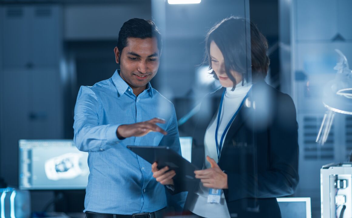 man and woman with tablet