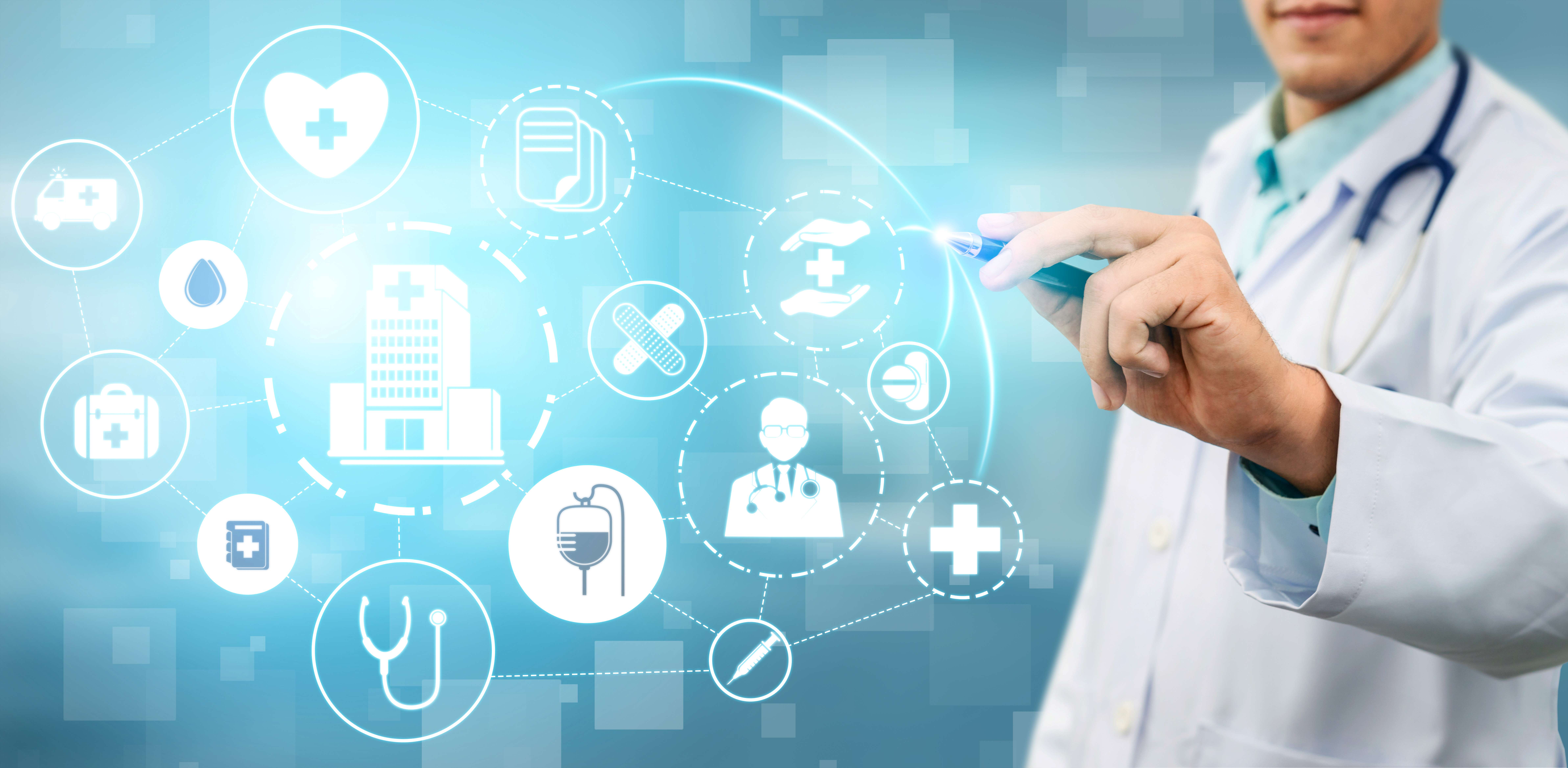 A healthcare professional interacts with a digital interface displaying medical icons, representing modern health technology and digital health innovation.