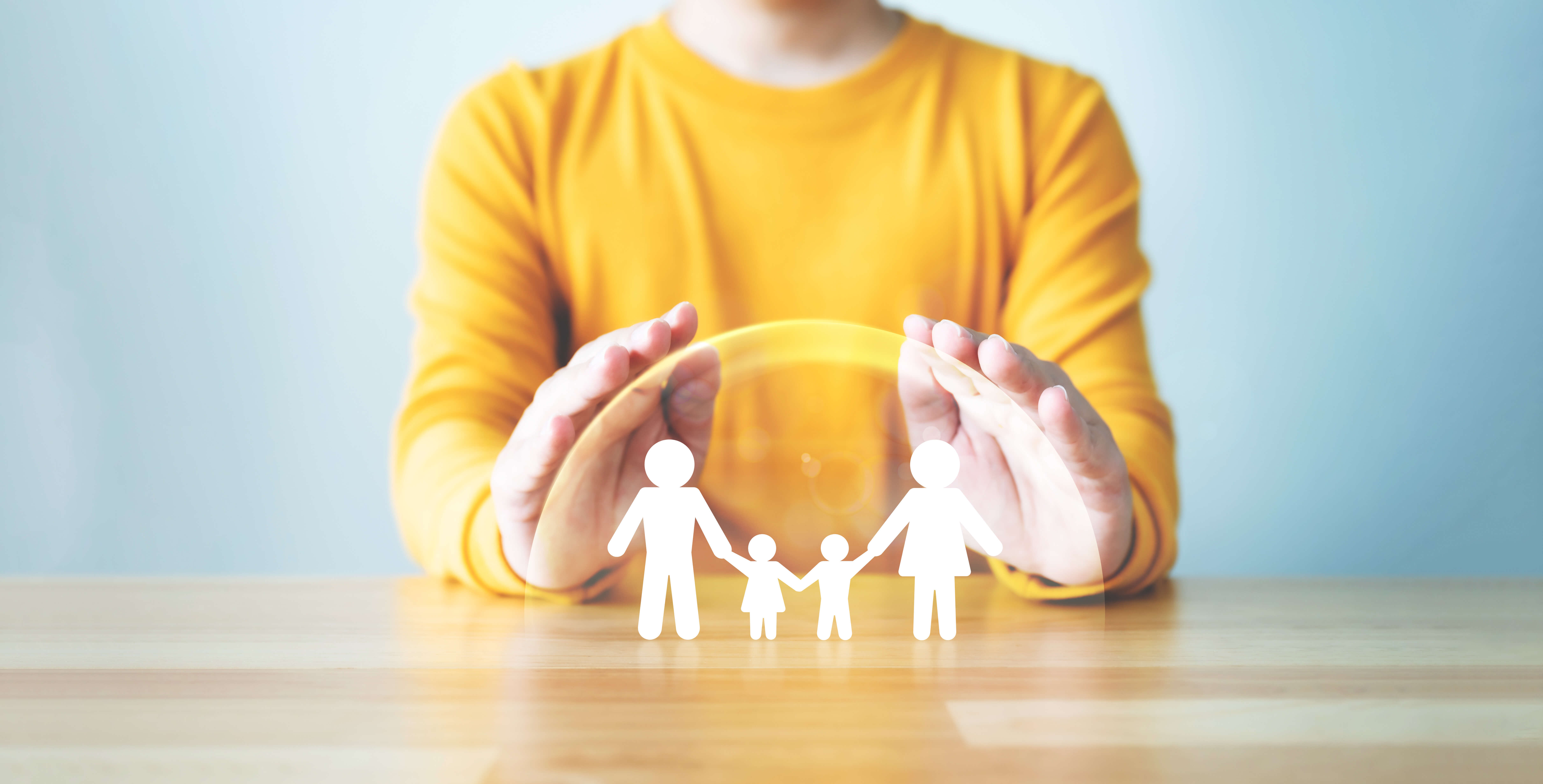 hands protecting family life insurance