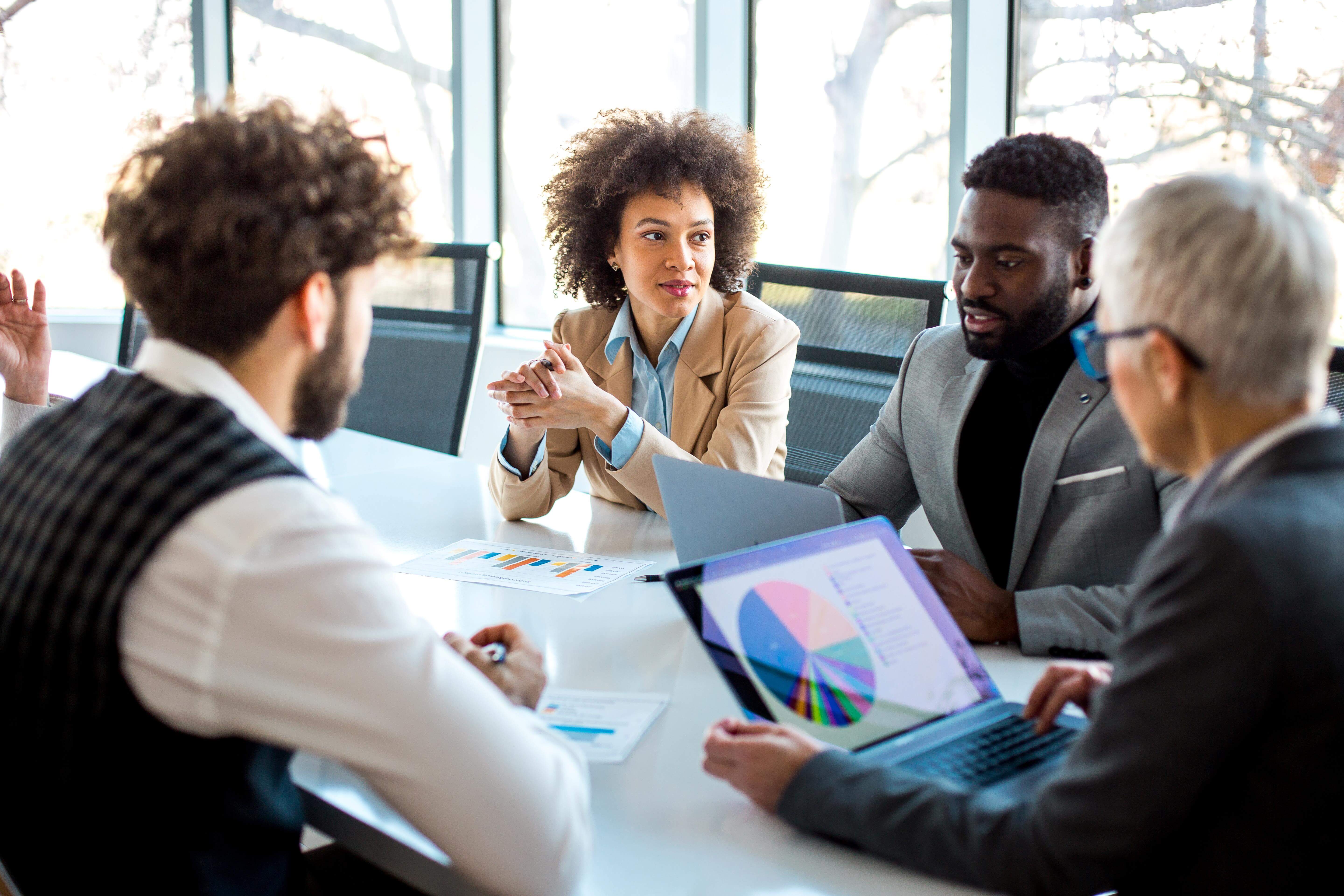 people conducting meeting in conference room