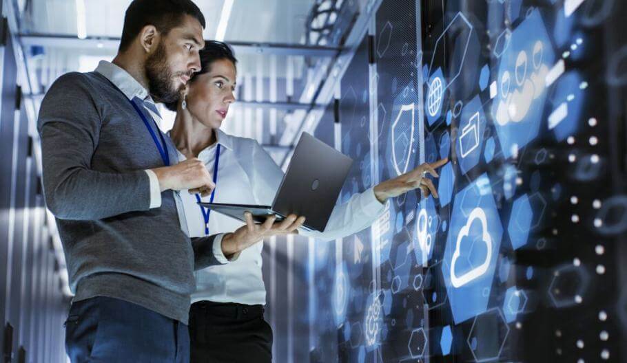 man and woman working in data server room or center