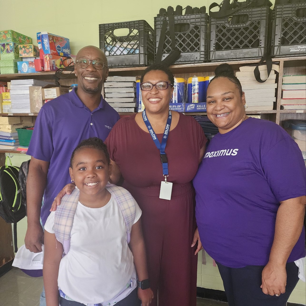 Maximus employees, Andre Price (left) and Dorian Hamilton (right), participate in the Adpot-A-Class program supporting local Chicago schools.