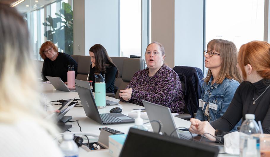 corporate communications sitting around a desk