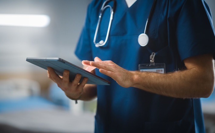 Nurse on a tablet.