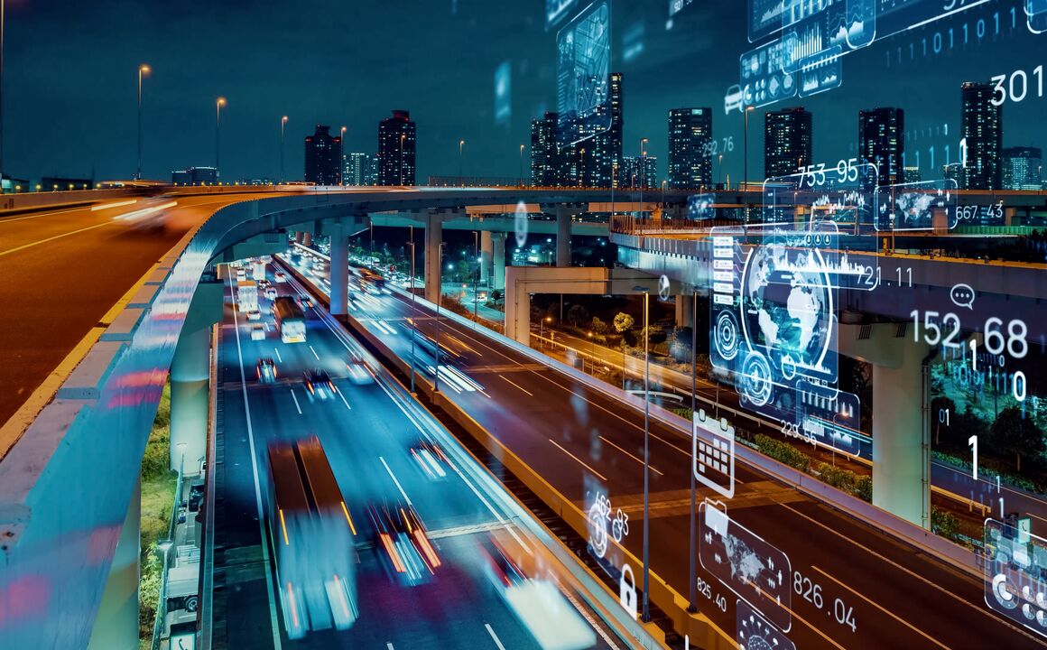 Digital city with cars driving on a freeway at night