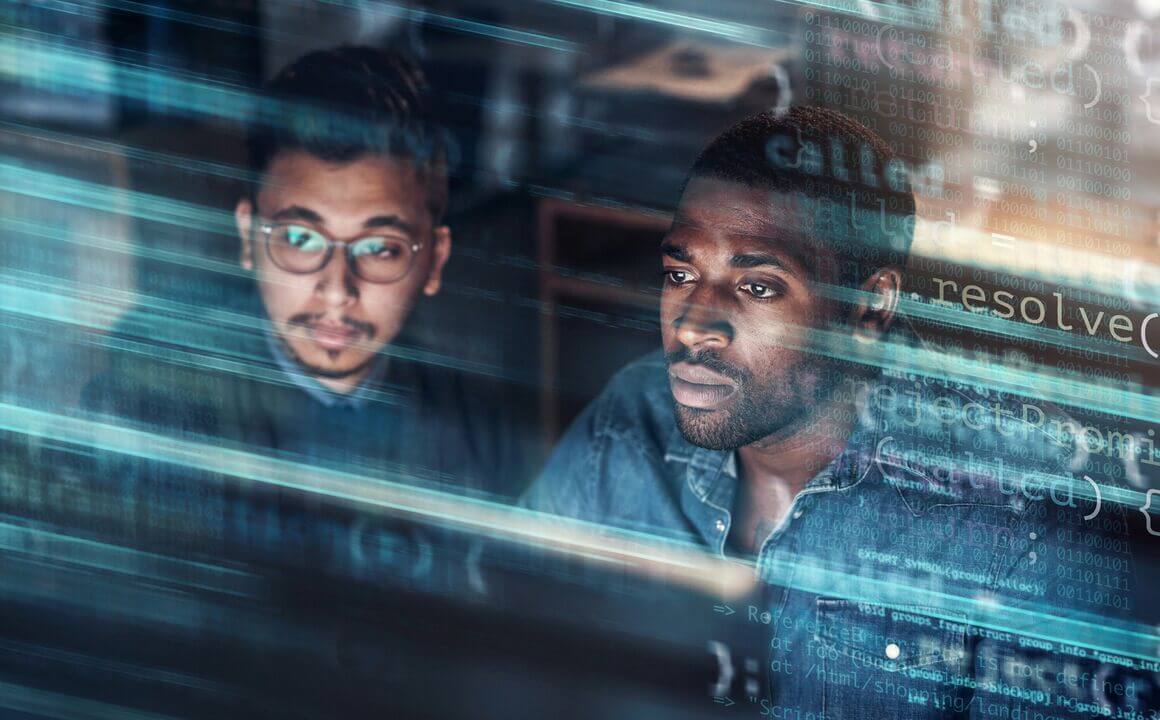 Two colleagues looking at data