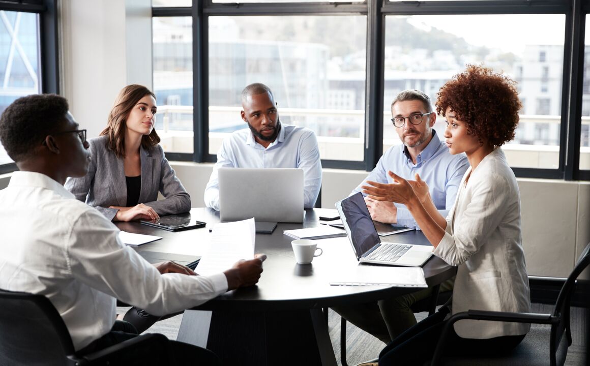 Business meeting with diverse office workers.