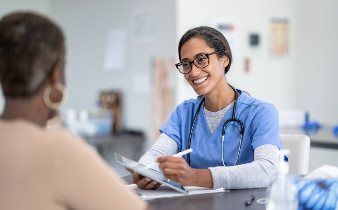 Female Medicaid provider checks the eligibility status of her patient on the tablet she's using to access the provider portal