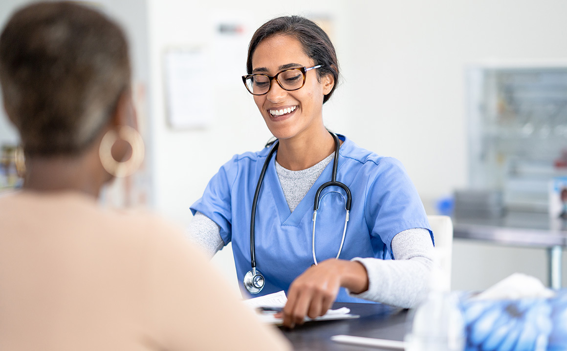 Image of a female doctor talking to a patient