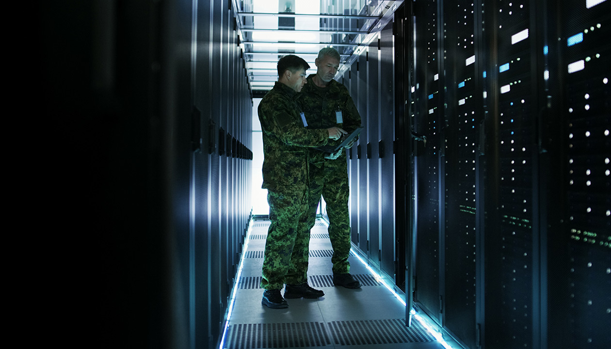 Image of military men in data center. 