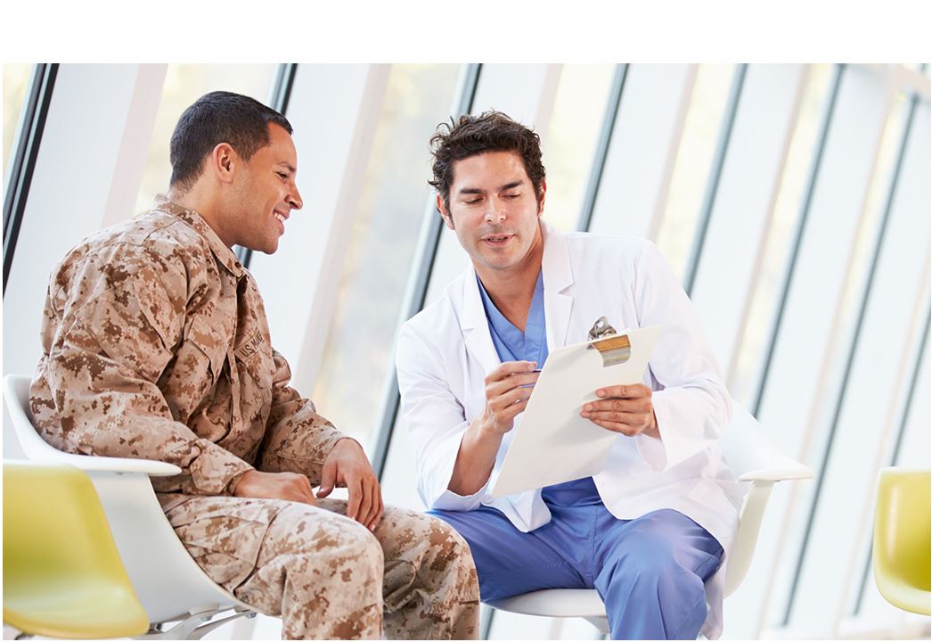 Image of a military veteran speaking to a medical professional