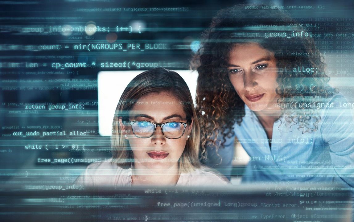 Image of two women looking at data