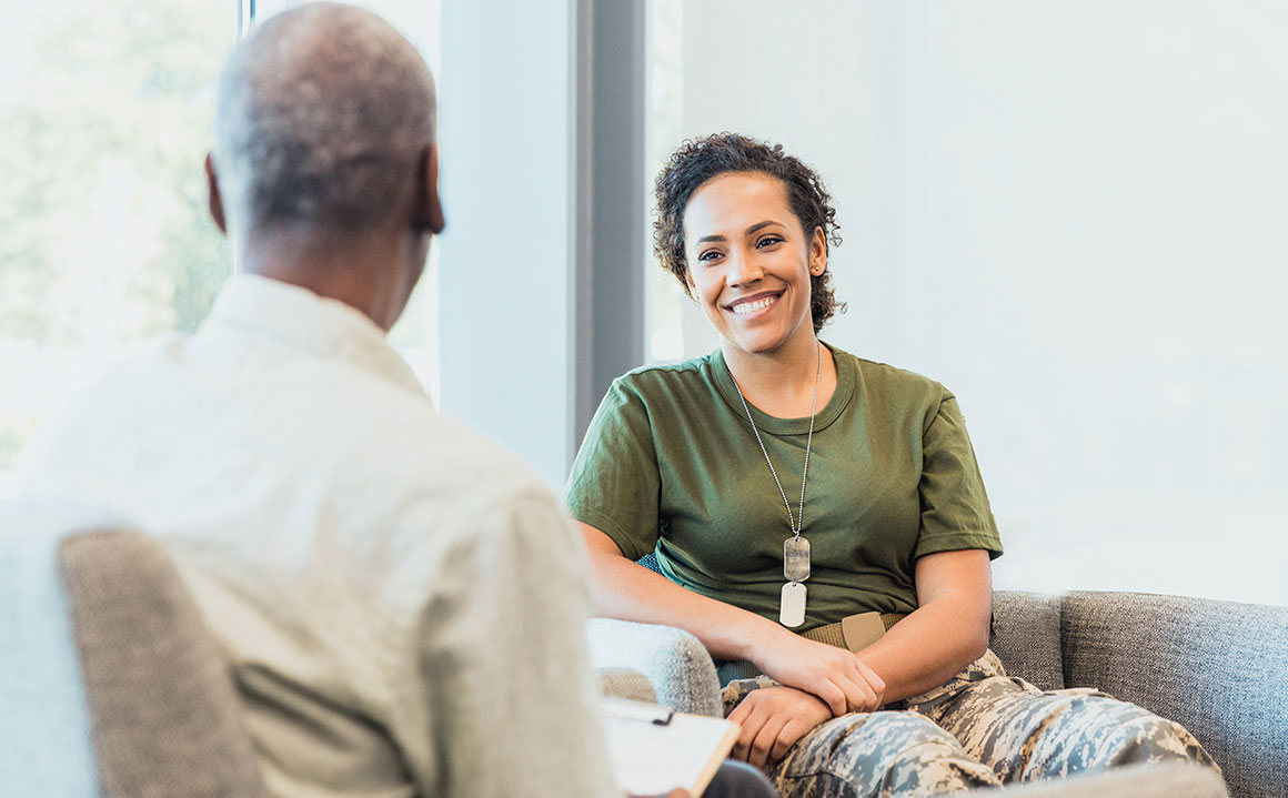 Female veteran speaking with a healthcare specialist