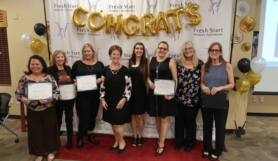 Image of Past Fresh Start clients being recognized and celebrated at a graduation event for the Small Business Start-Up Certificate and the DreamBuilder program. 