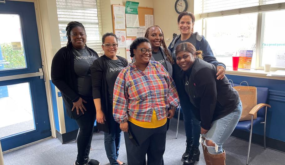 Maximus Foundation Ambassador Taniel Bennett, a call center support manager poses with Karen Gardiner Bryan, Massiel Concepcion, Onjouleque Brown, Elizabeth Ortiz, and a Millhill staff member after a day of volunteerism. 