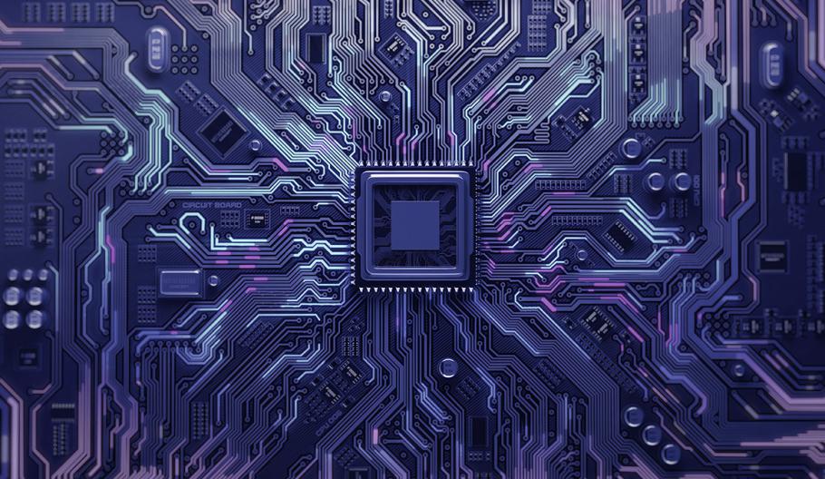 Image of a circuit board with a chip in the middle. 