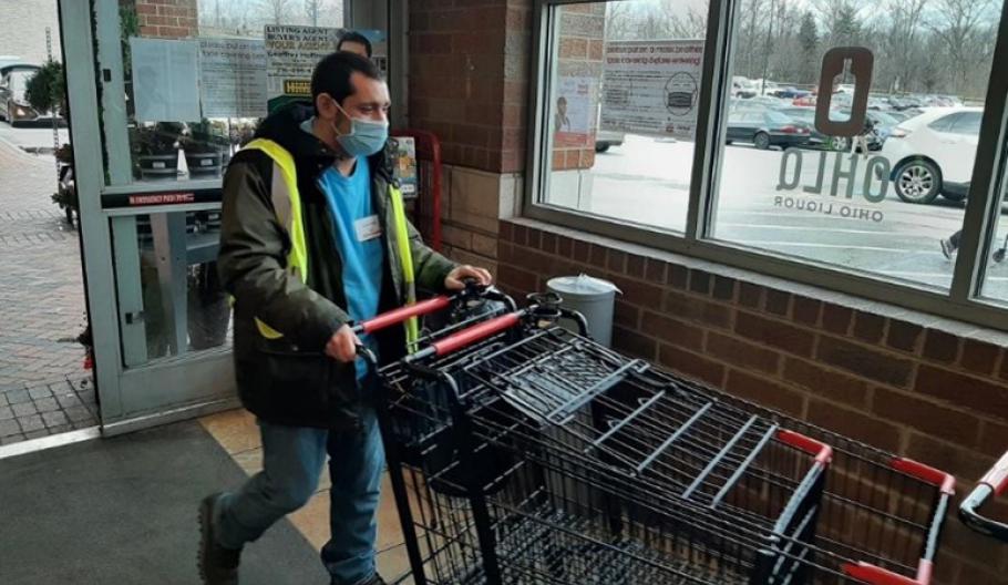 Image of a man pushing a grocery cart
