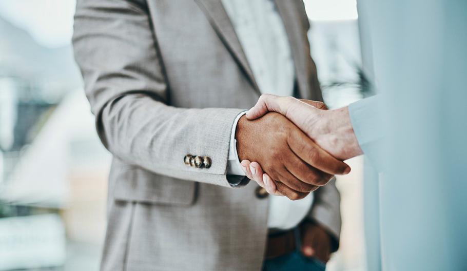 Image of two business people shaking hands