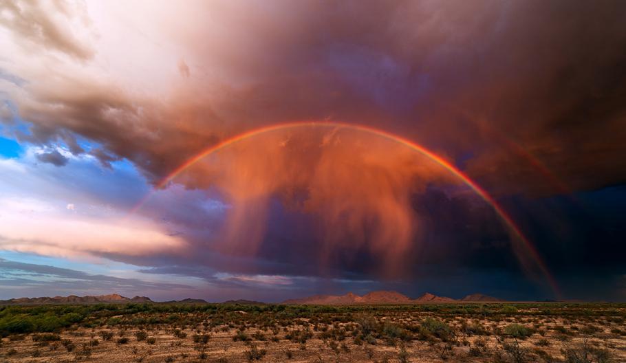 Image a rainbow over a desert