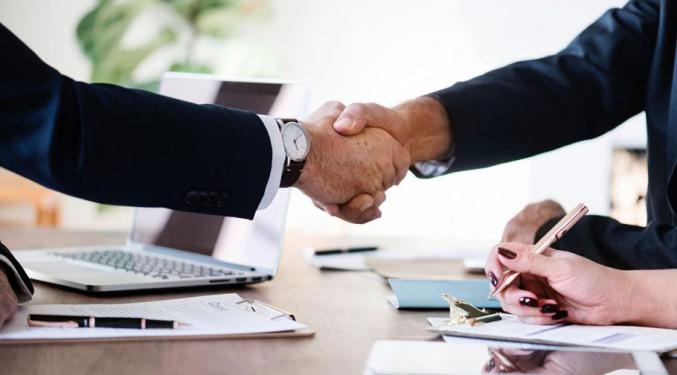 Image of two hands shaking hands after a successful business meeting