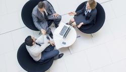 Image of three business people meeting