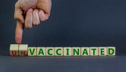 Image of blocks that spell out unvaccinated.