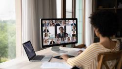 Image of a woman in a video chat with business colleagues