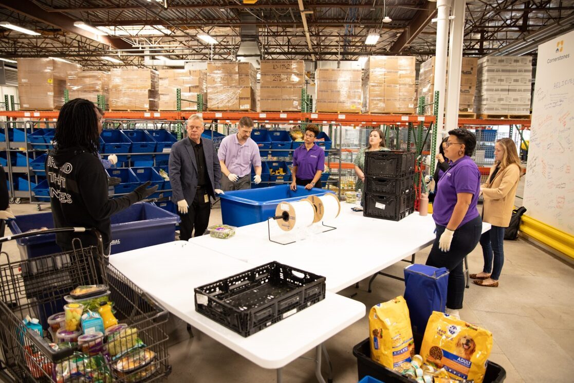 A group of Maximus employees volunteering at a local organization.